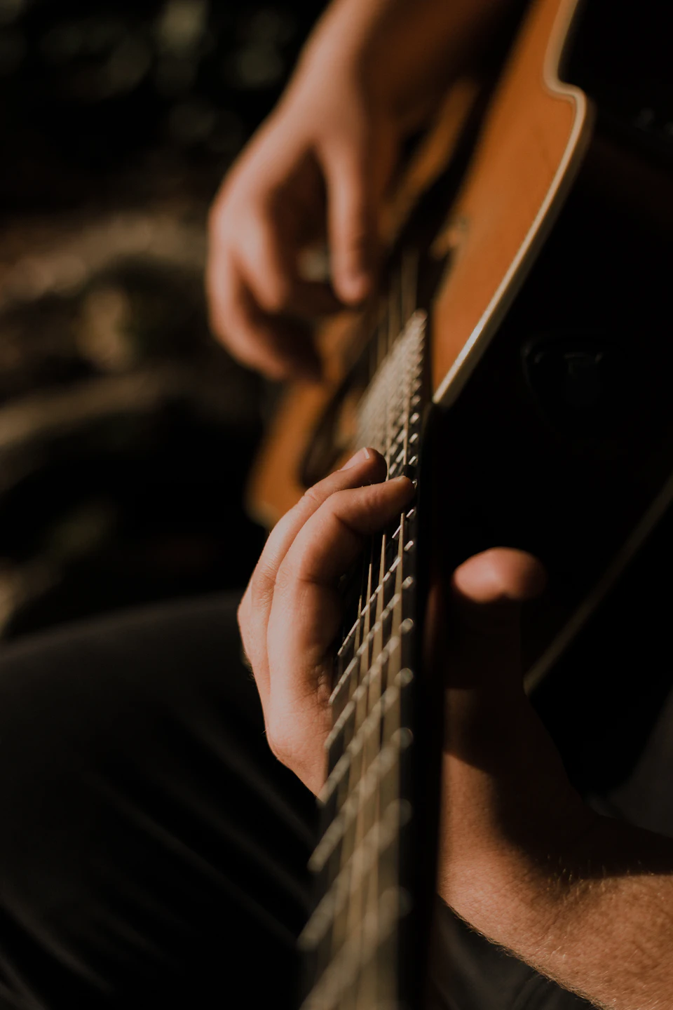 Person playing guitar