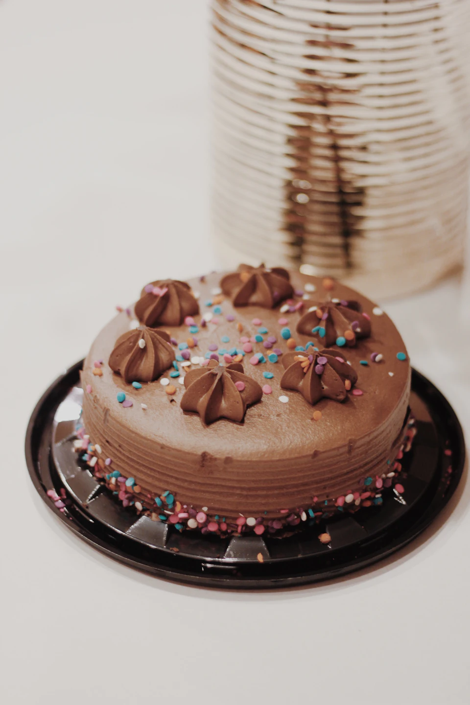 Round chocolate coated cake