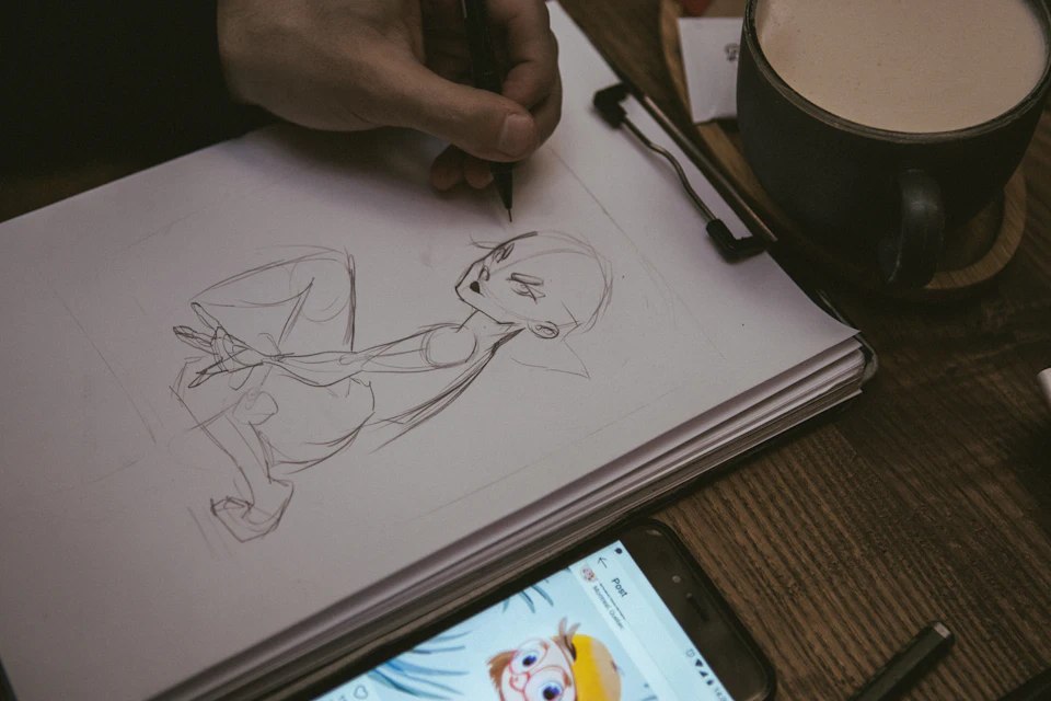 Man drawing portrait of man