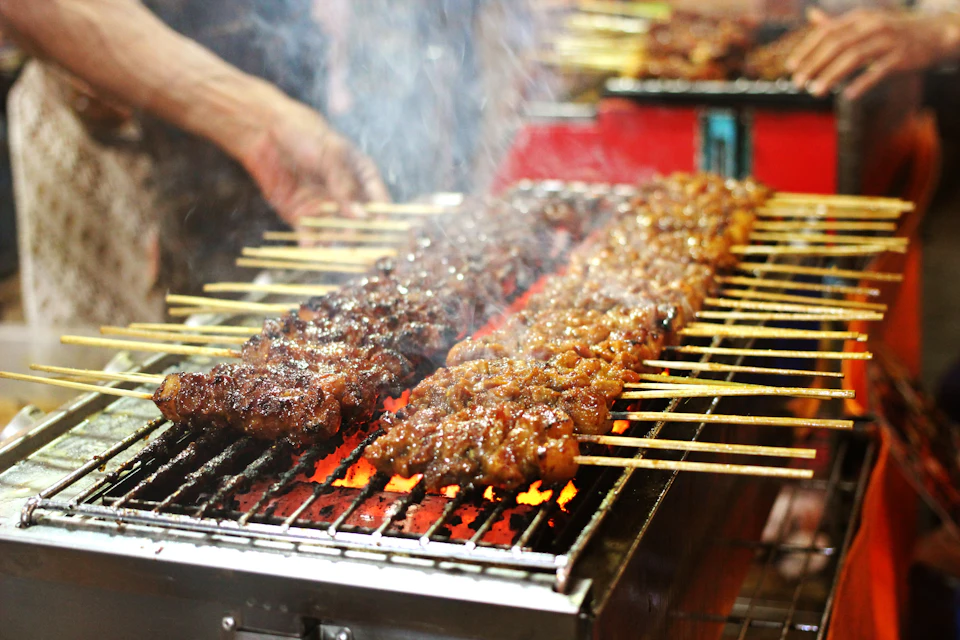 Grilled meat on charcoal grill