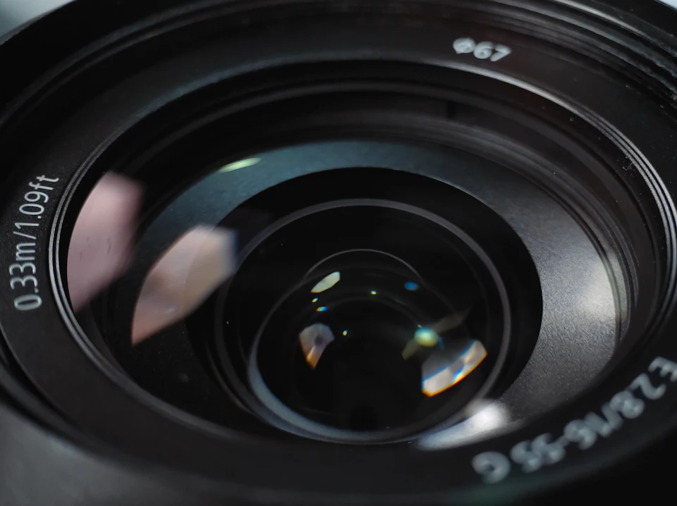 Close-up of a camera lens with reflections