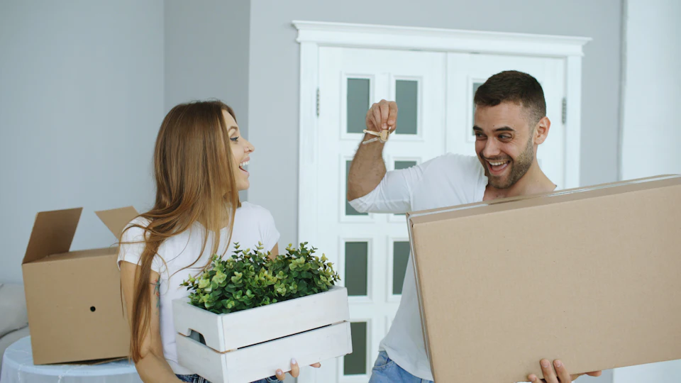 Couple happily moving into a new home